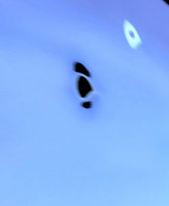 The key observation is that this manipulation separates a green light from the main UFO image