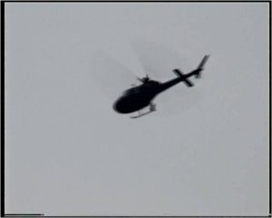 A mysterious, camera-equipped helicopter hovering low during a period of intense UFO sightings.